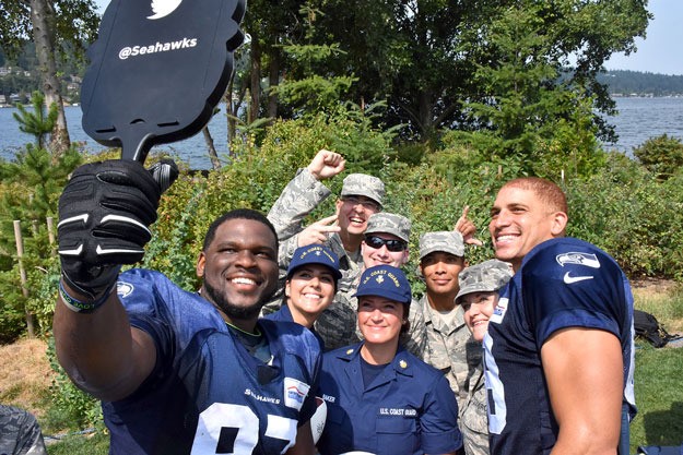 Seahawks players take a selfie with members of the military