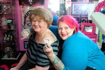Columnist Jaris English poses for a photo with Majenta after getting her first tattoo.