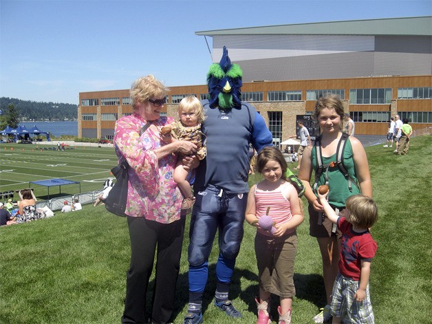 The Ossorio clan poses with Rooster at a Seahawks training camp adventure.