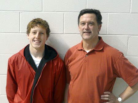 Renton High School junior Steve Sholdra (left) stands with RHS graduate Mark Prothero before the 3A state meet in 2010.