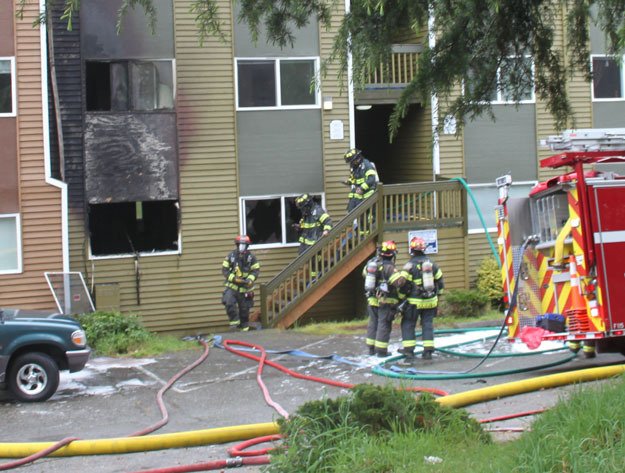 Firefighters leave the scene of a Tuesday apartment fire at Sunset Pointe Apartments.
