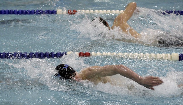 Liberty’s Nick Klatt (front) swims past Hazen’s Chase Onstot in the 200-yard freestyle Jan. 3.