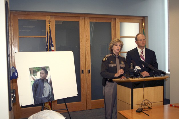 County Sheriff Sue Rahr and county Prosecutor Dan Satterberg announced Thursday the filing of first-degree murder charges in the homicide of 12-year-old Alajawan Brown April 29. Satterberg first diagrammed the shooting on the poster board