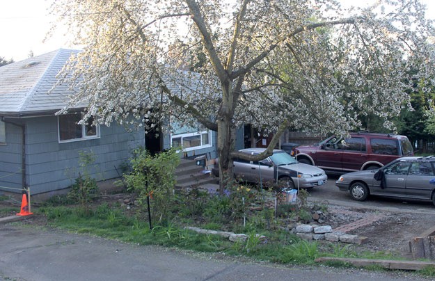 The house at 370 Earlington Avenue Southwest has been visited by police 27 times in the past three years.