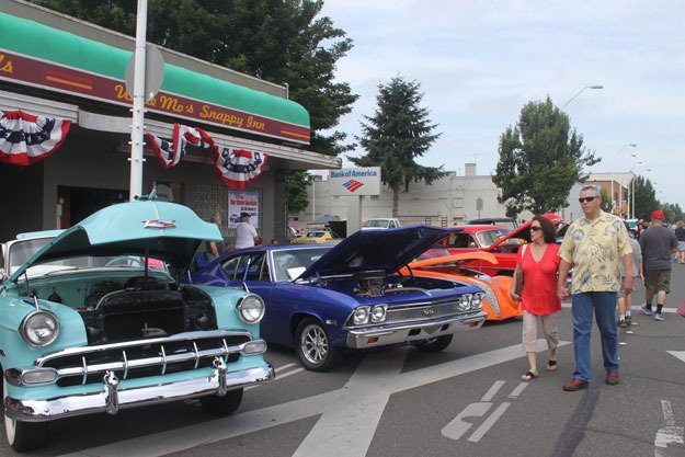 Residents check out the rides during the 2013 Return to Renton car show.