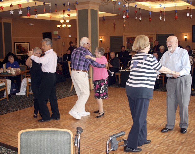 A 17-piece band played the music of the 1940s for dancing to and as a backdrop to a fundraiser at Merrill Gardens at Renton Centre Friday afternoon for the USO.