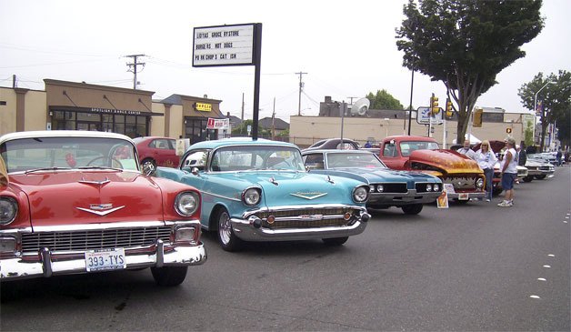 Classic cars and hot rods line the street at last year's Return to Renton Car Show.