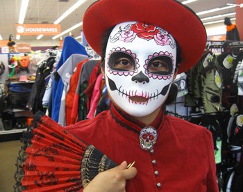 The Highlands Goodwill staffer Crystal Lopez is decked out in a Day of the Dead costume