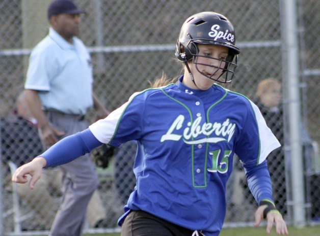 Liberty shortstop Denise Blohowiak rounds first base against Bellevue March 26.