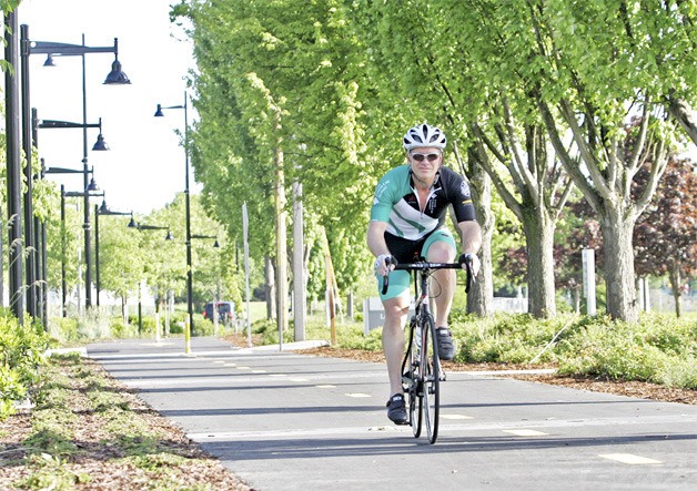 A cyclist enjoys the new Logan Avenue North Trail.