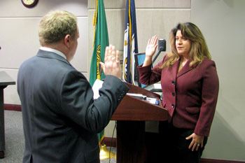 Ruth Perez (right) is sworn into the Renton City Council by Renton City Clerk Jason Seth at Monday's council meeting.
