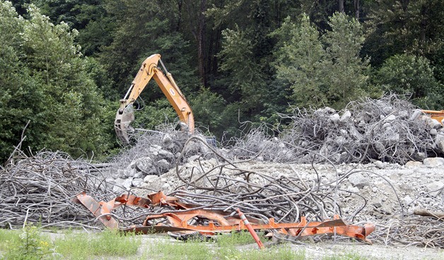 The steel and concrete from the old Benson Road bridge is being sorted at the former Stoneway concrete plant on the Maple Valley Highway. The steel and concrete will be recycled.