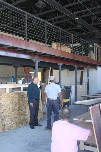 Workers are getting the new Cheers sports bar ready to open by Sept. 1.