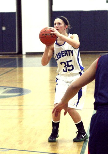 Liberty’s Delane Agnew shoots against Juanita High School last season.