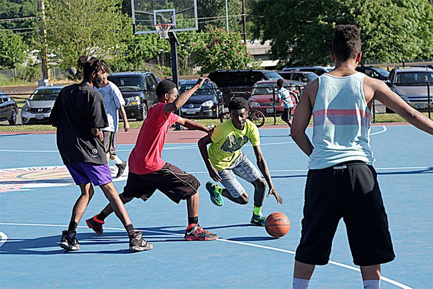 Teens enjoy a game of hoops at Liberty Park last weekend.