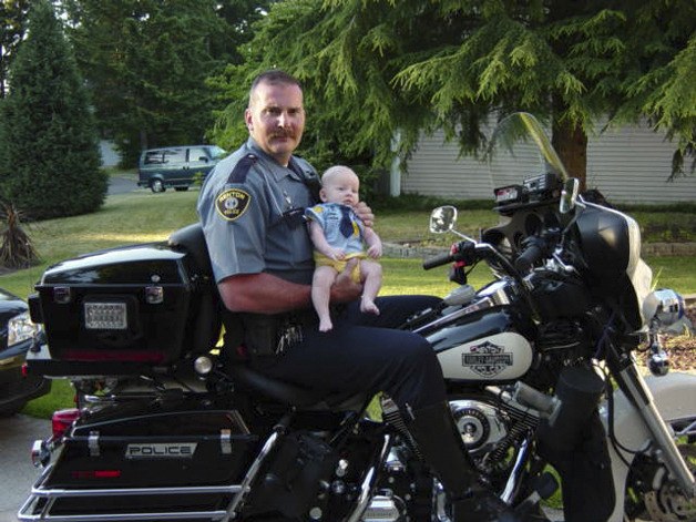 Marty Leverton  holds his daughter Amy on his motorcycle when she was about four months old. Today