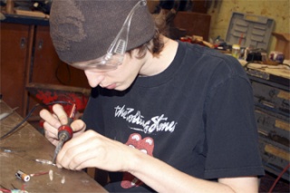 Senior Scott Greivell works on an LED light for the ring he hopes to enter into the 2009 Passing the Torch jewelry/metals exhibition at North Seattle Community College.