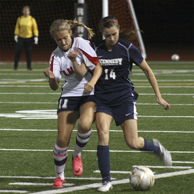 Lindbergh’s Jordyn McLuen fights for the ball with a Kennedy defender.
