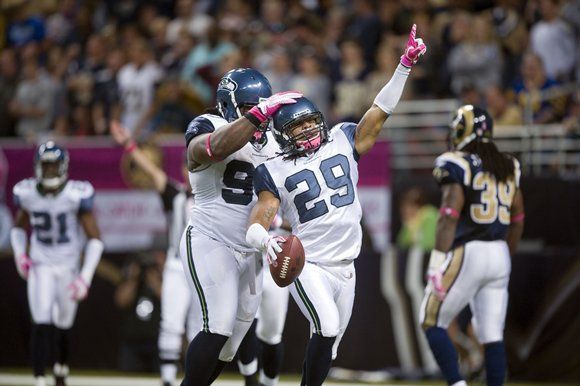 Safety Earl Thomas celebrates after an interception Sunday against the Rams.