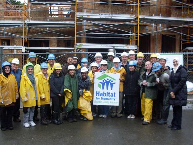 Together We Build volunteers participate in community service projects with Habitat for Humanity at La Fortuna in Renton.