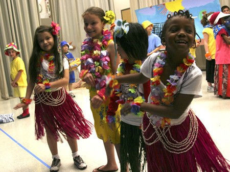 The hula dancers practice before their main performance in a second grade written and produced opera at Tiffany Park Elementary. From the left