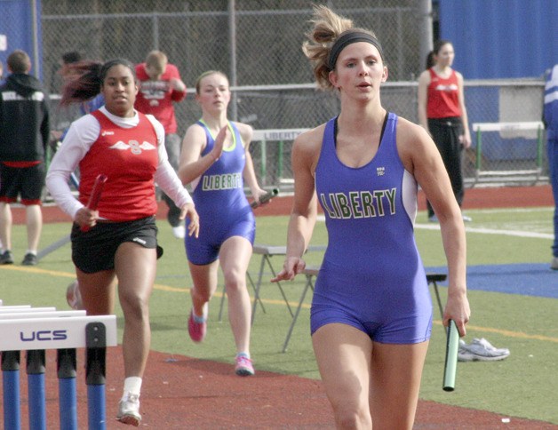 Liberty's Delane Agnew runs in the 4 X 200 relay March 22.