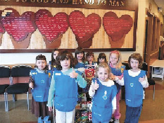 Renton Daisy Troop 40860 recently donated 87.46 pounds of food to the Salvation Army Renton Rotary Food Bank and Service Center. The girls also spent an afternoon labeling pastries and measuring out two-pound bags of flour