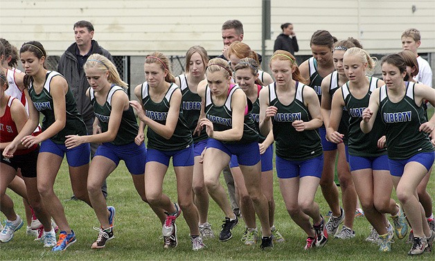 The Liberty girls cross-country team takes off from the starting line Oct. 12 at Mount Si.