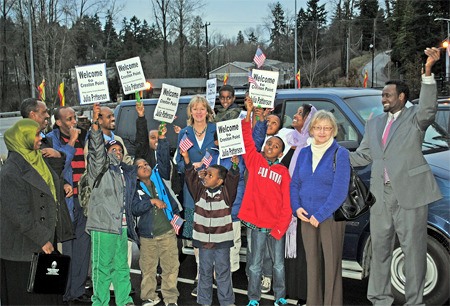 County council member Julia Patterson meets with clients of the Somalit Youth and Family Club Jan. 11 after delivering a retired Metro Vanpool Van to the Human Services program.
