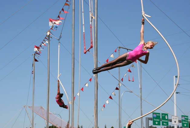 Members of the youth circus perform at the Renton River Days Parade.