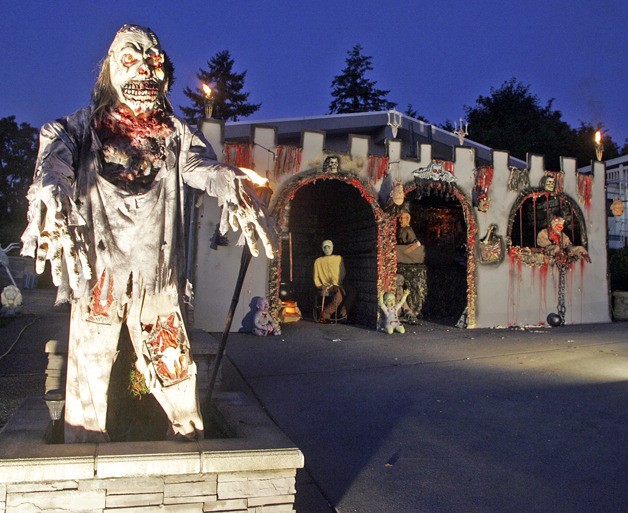 One of Peter Moore's ghouls will provide the chill for his Halloween display in the Monterey Terrace neighborhood.