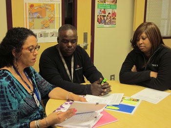 Warren and Elnora Fontenette share their gratitude for Communities in Schools of Renton with liaison Ginny Fulmer.