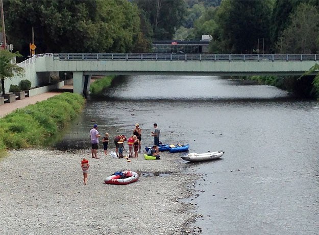 A group of rafters take a break just past the library in downtown Renton.