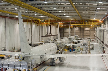 Four P-8 aircraft are lined up in Boeing's mission system and checkout facility in Seattle.