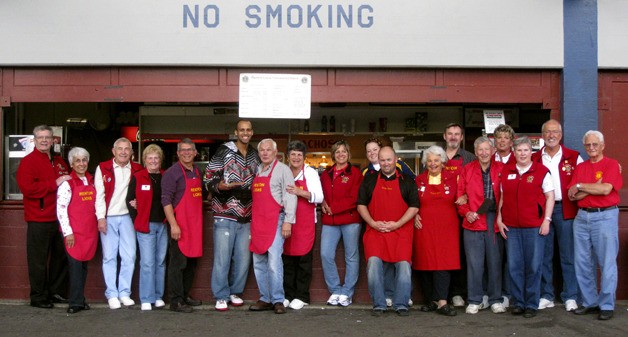 Members of the Renton Lions Club gathered for their last day running the Renton Memorial Stadium concession stand after about 44 years. From the left