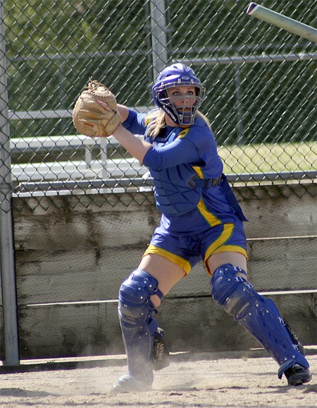 Hazen senior catcher Chelsea Moorhead tries to pickoff a runner at first during a Seamount/SPSL sub-district game.