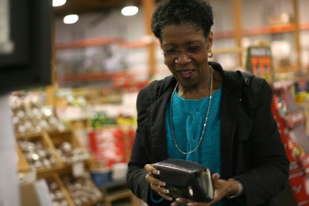 Brenda Renrick buys groceries at Renton's DK Market. The market is a hotspot for bargain hunters who wish to fill their cupboards with fresh vegetables.