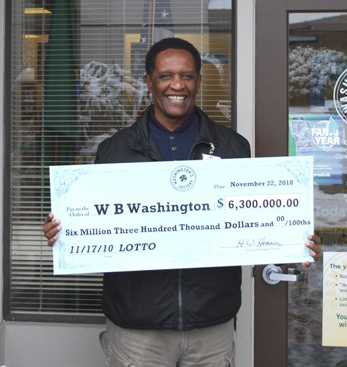 W.B. Washington of Renton displays the check for $6.3 million he won for having the winning Lotto ticket.