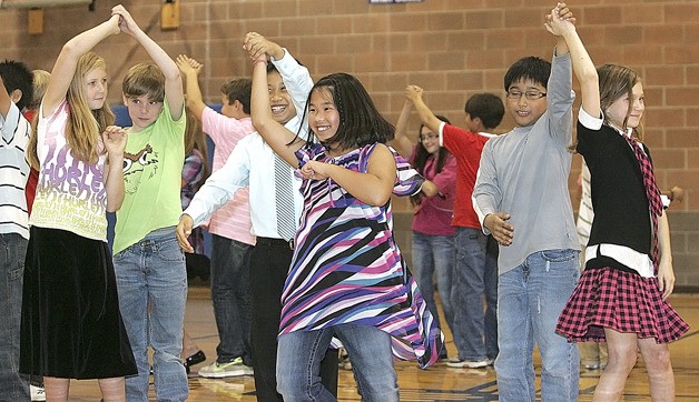 St. Anthony School fifth graders twirl their partners Friday