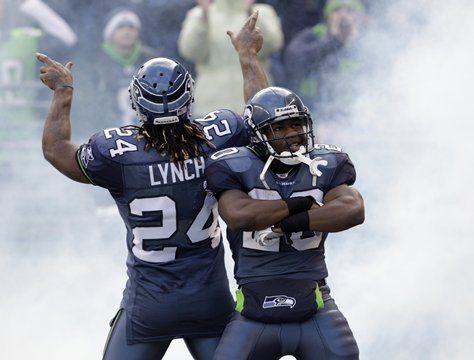 Marshawn Lynch and Justin Forsett pump up the crowd while being introduced prior to Saturday's playoff win against the Saints.