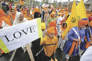 Sikhs parade down Talbot Road in Renton Saturday in celebration of their community’s founding in 1699. Amol Hundal