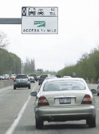 A sign notifies drivers of a HOT lane access point on southbound Highway 167 in Renton. The HOT lanes open this Saturday.