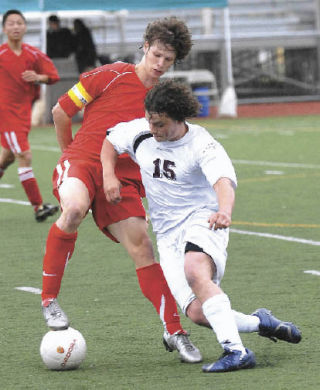Renton’s Brandon Schaefer (red) steals the ball from Joey Jackson of White River.