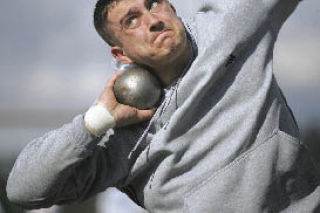 Hazen’s Andrey Levkiv warms up with the shot put in track practice at Hazen.