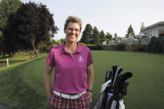 Leslie Folsom poses on the edge of the practice putting green Tuesday at the Rainier Golf and Country Club in Seattle.