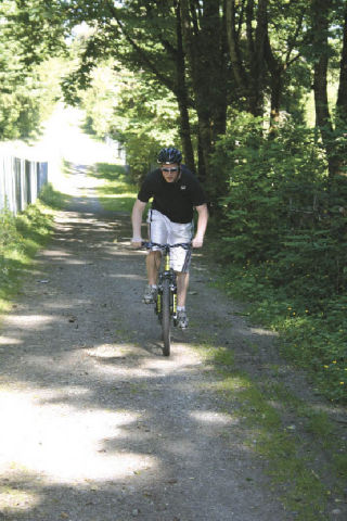 Adam McFadden rides up one of the gradual slopes on the second half of the Lake Youngs trail.