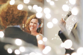 Rebecca Kavan smiles at her groom while being “married” a second time in front of residents of Chateau at Valley Center