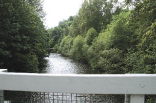 The view of Cedar River from the bridge at Riverview Park.