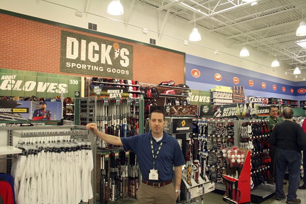 Store manager Damon Stamoolis stands in one of the many displays throughout the new Dick’s Sporting Goods at The Landing.