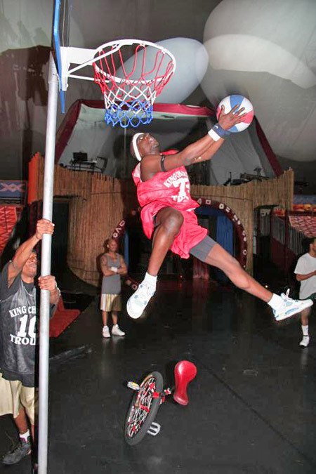 Kip Jones dunks during a show with the King Charles Troupe.